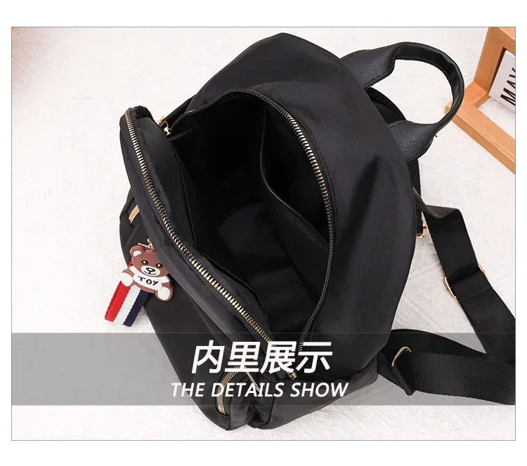 2024 Women's New Solid Color Zipper Waterproof Nylon Fashion Backpack Large Capacity Casual and Versatile Commuting Backpack