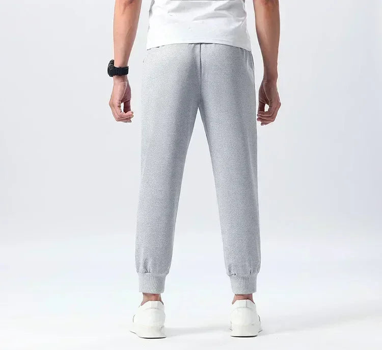 Pantalon de survêtement pour homme, nouveau modèle d'automne et d'hiver, avec lettres imprimées, style trapèze de basket-ball, leggings, pantalon de survêtement en coton, pantalon décontracté de grande marque