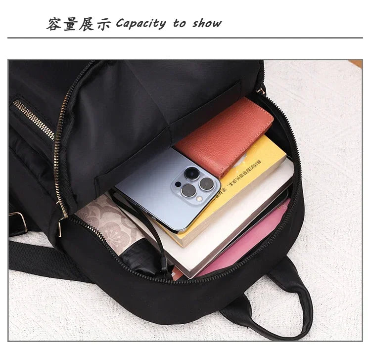 2024 Women's New Solid Color Zipper Waterproof Nylon Fashion Backpack Large Capacity Casual and Versatile Commuting Backpack